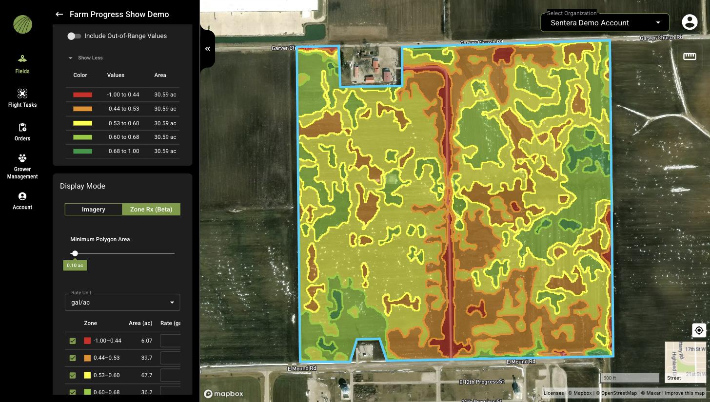 An NDVI layer in Zone Rx (Beta) display mode: the map shows outlined zones in five colors, and the panel shows the color table, the Display Mode selector, the Minimum Polygon Area slider at 0.10 ac, the Rate Unit gal/ac, and the start of the zone rate table