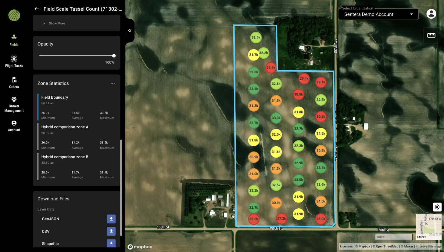 The Tassel Count layer details with the Zone Statistics section listing Field Boundary, Hybrid comparison zone A, and Hybrid comparison zone B, each with its area and Minimum, Average, and Maximum tassels per acre, above the Download Files section